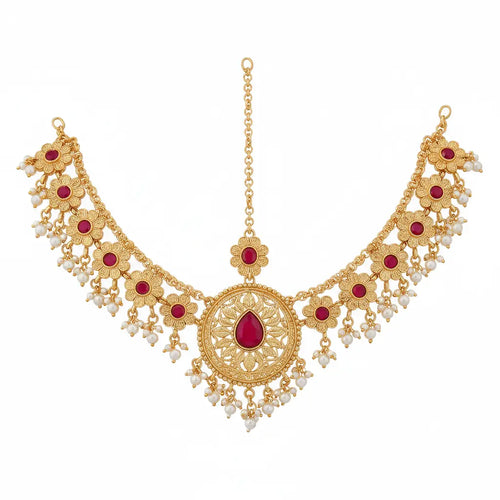 Gold-toned filigree necklace with red gemstone accents and dangling pearl-like beads, shown on a plain white background.