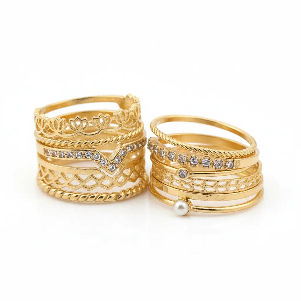 Set of gold rings with various designs on a white background